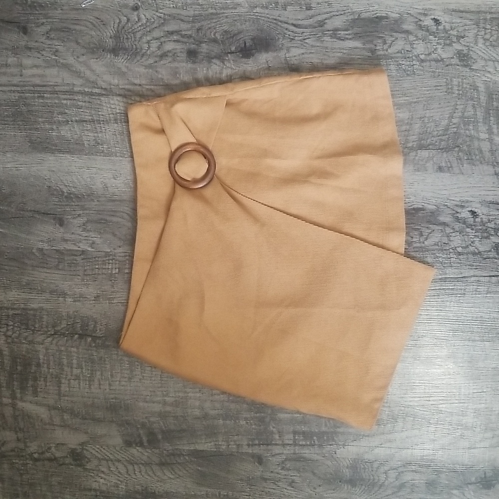 Tan wrap skirt with wooden attachment